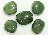 light green crystal with black spots