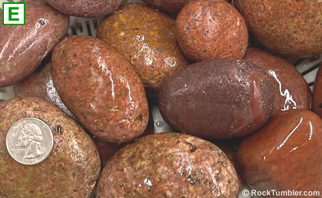 Red Beach Stones tumbling rough sprayed with water to reveal its full color