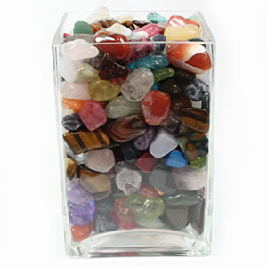 a colorful container of tumbled stones